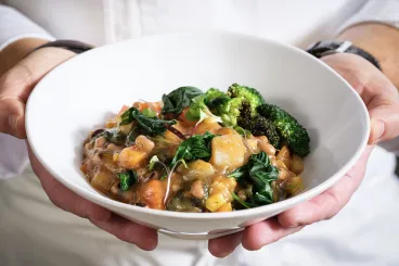chef holding a fresh dish