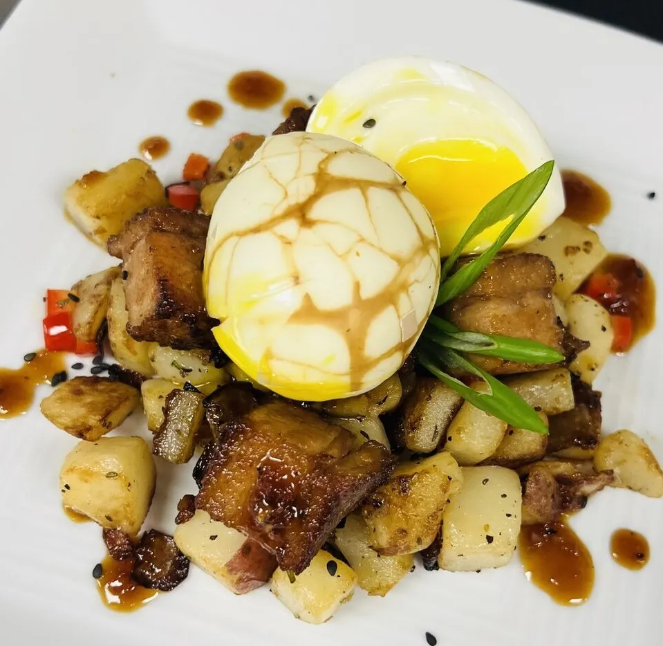 Egg and potato dish on white plate