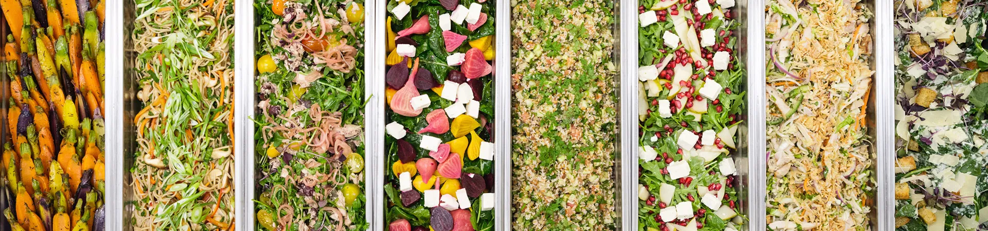 array of vegetable and pasta salads