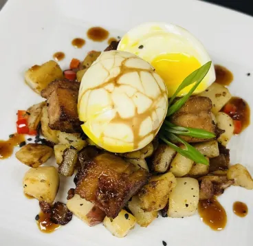 Egg and potato dish on white plate